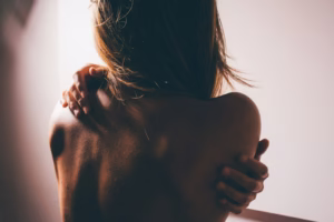 close photo of woman's back, Pinched Nerve in Shoulder
