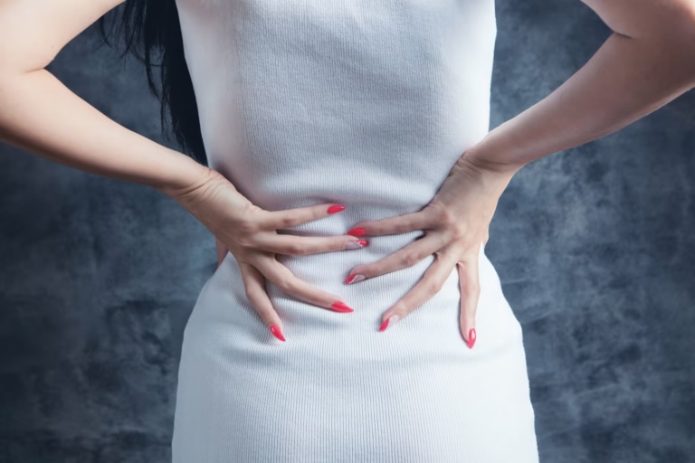 woman in white sleeveless dress -performing a gentle thoracic spine stretch to relieve back ache when breathing deeply, sitting upright with proper posture.