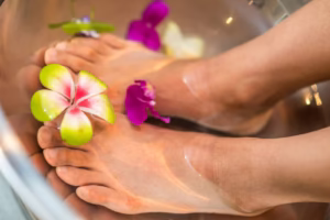 person's feet with flowers, Discover why tingling in feet happens and what it really means. From nerve damage to circulation issues, learn the surprising causes, treatment options,